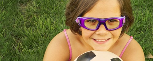 Little girls wearing protective eyewear for soccer