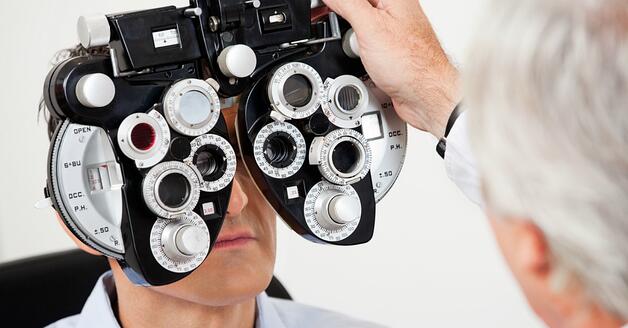 Man recieving eye exam at bard optical