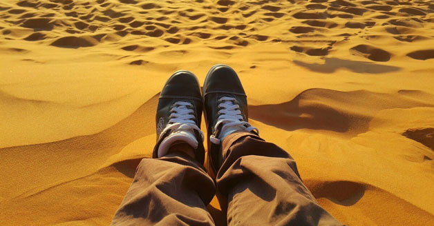 Shoes in a dry sandy desert