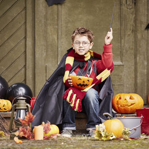 Child in harry potter costume with glasses
