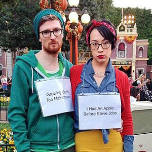 Guy and girl wearing hipster glasses costume