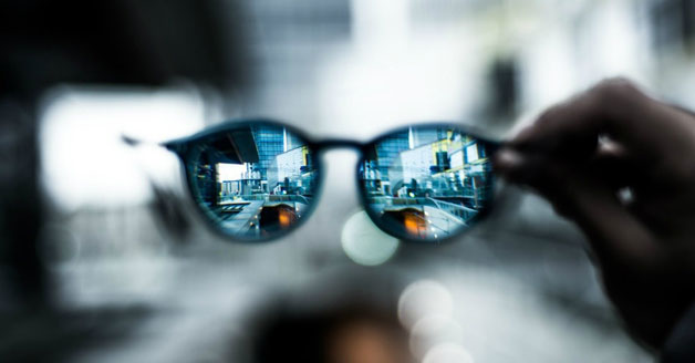 Glasses lenses looking onto a city street
