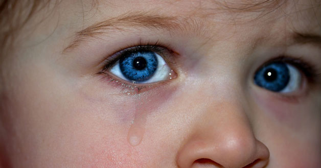 Blue eye crying tears