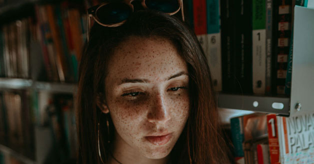 Freckle faced woman with presbyopia