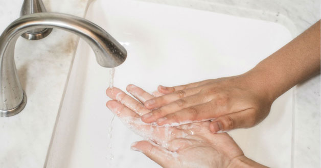 Hands washing with exfoliating scrubs