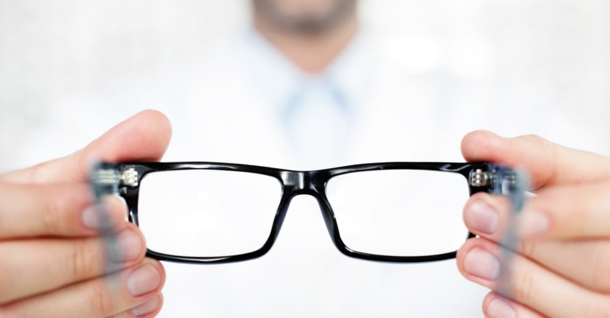 Optometrist offering glasses