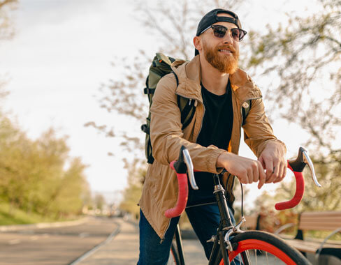 Man wearing progressive sunglasses with bicycle
