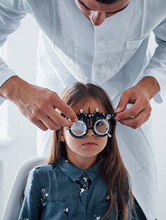 Little girl getting pediatric eye exam in Bard Optical Jacksonville