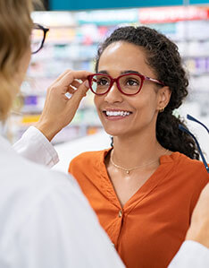 Woman getting eyewear options from eye doctor in Bard Optical