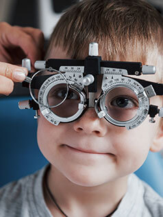 Little boy getting pediatric eye health exam in Bard Optical Washington