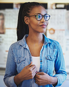 Woman wearing Bard Optical Jacksonville Eyeglasses