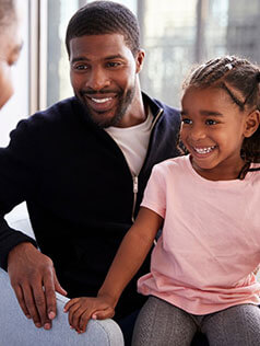 Father and daughter at Bard Optical in Canton for an eye exam