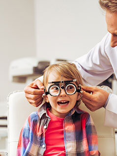The surprised boy got an eye exam at Bard Optical in Forsyth