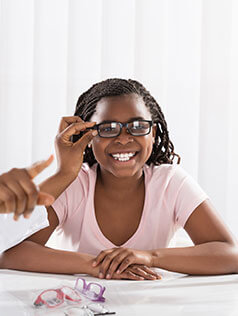 Girl wearing glasses smiling