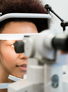 Girl getting an contact lens exam at Bard Optical in Normal