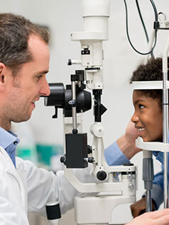 Boy getting an eye exam at Bard Optical Normal