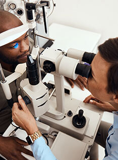 Man getting a contact lens exam at Bard Optical in Peoria Knoxville