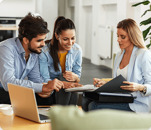 Woman explaining insurance to couples