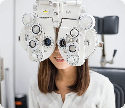 Woman getting contact lens exam